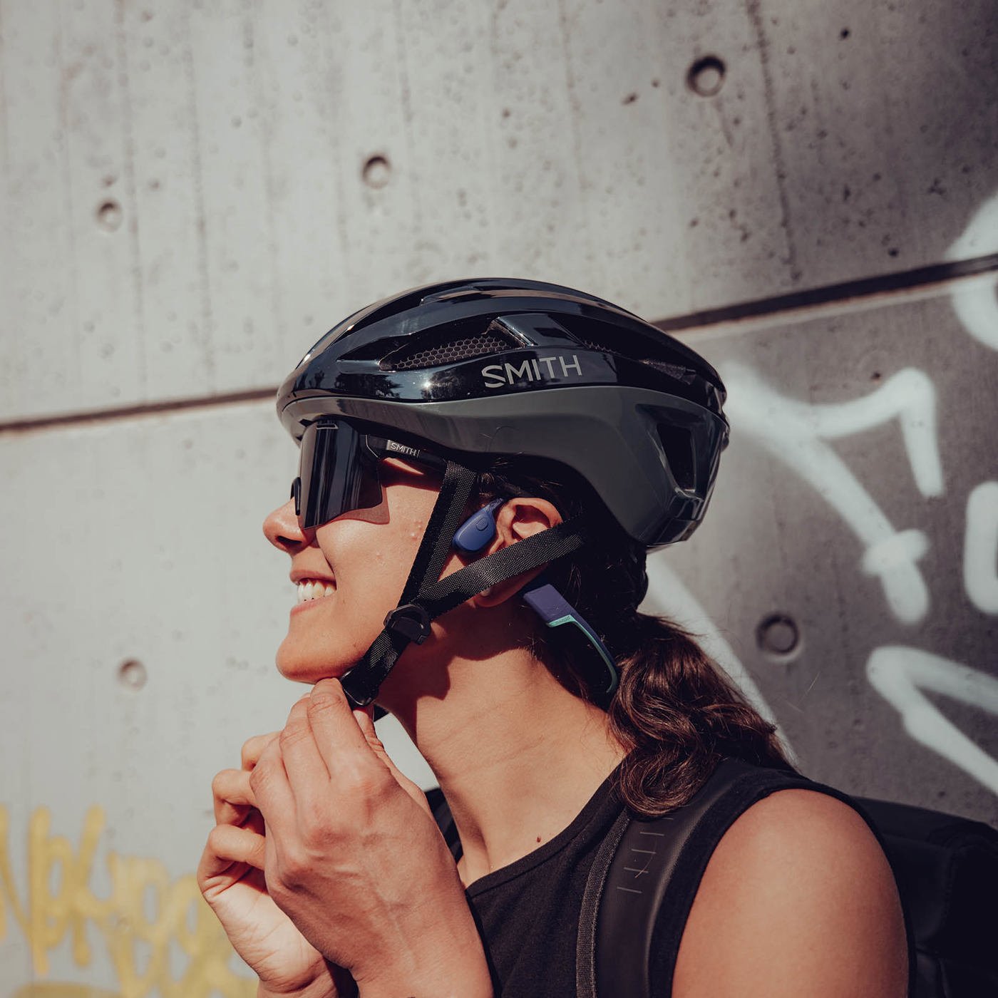 a woman wearing a helmet and sunglasses
